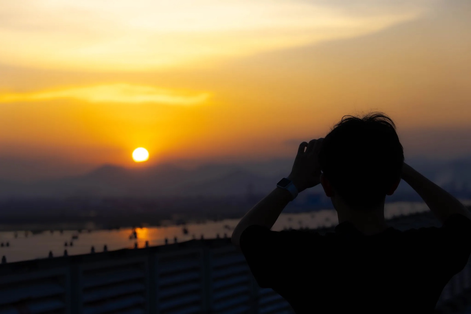 Kaituo Zhang looking toward a sunset